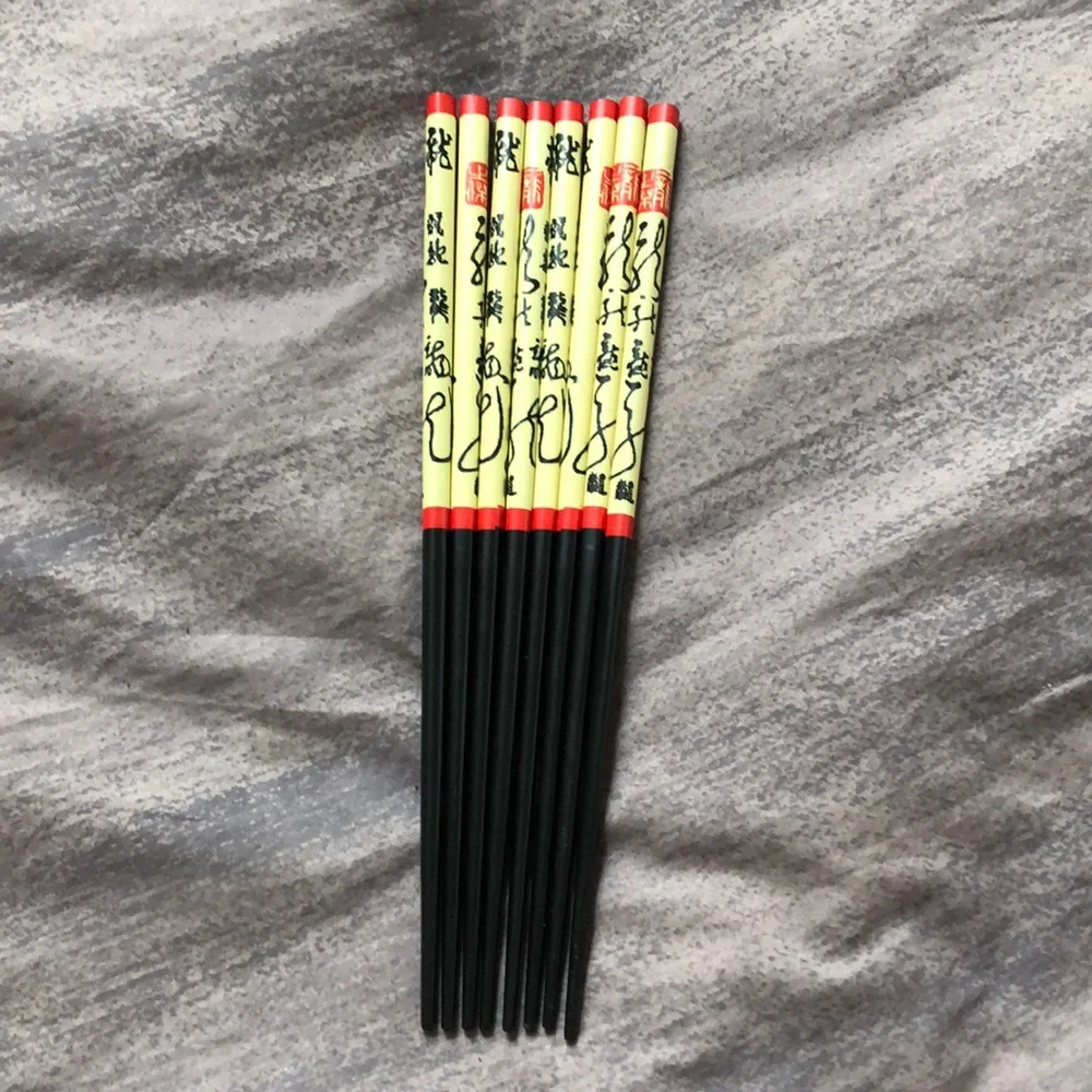 Set of 8 chopsticks, never used.